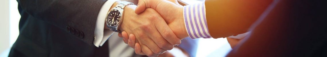 Business people shaking hands, finishing up a meeting